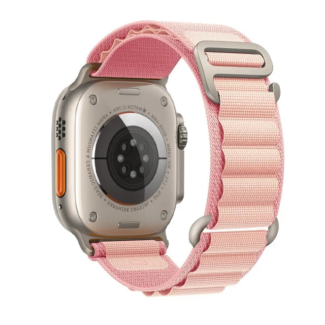 Apple Watch with pink nylon strap, featuring a rugged design for durability and comfort, perfect for outdoor adventures.