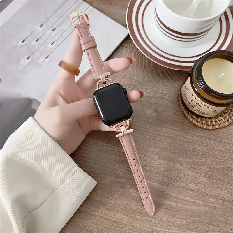 Apple Watch Genuine Leather Strap in pink, held in hand; stylish and durable design for any occasion.