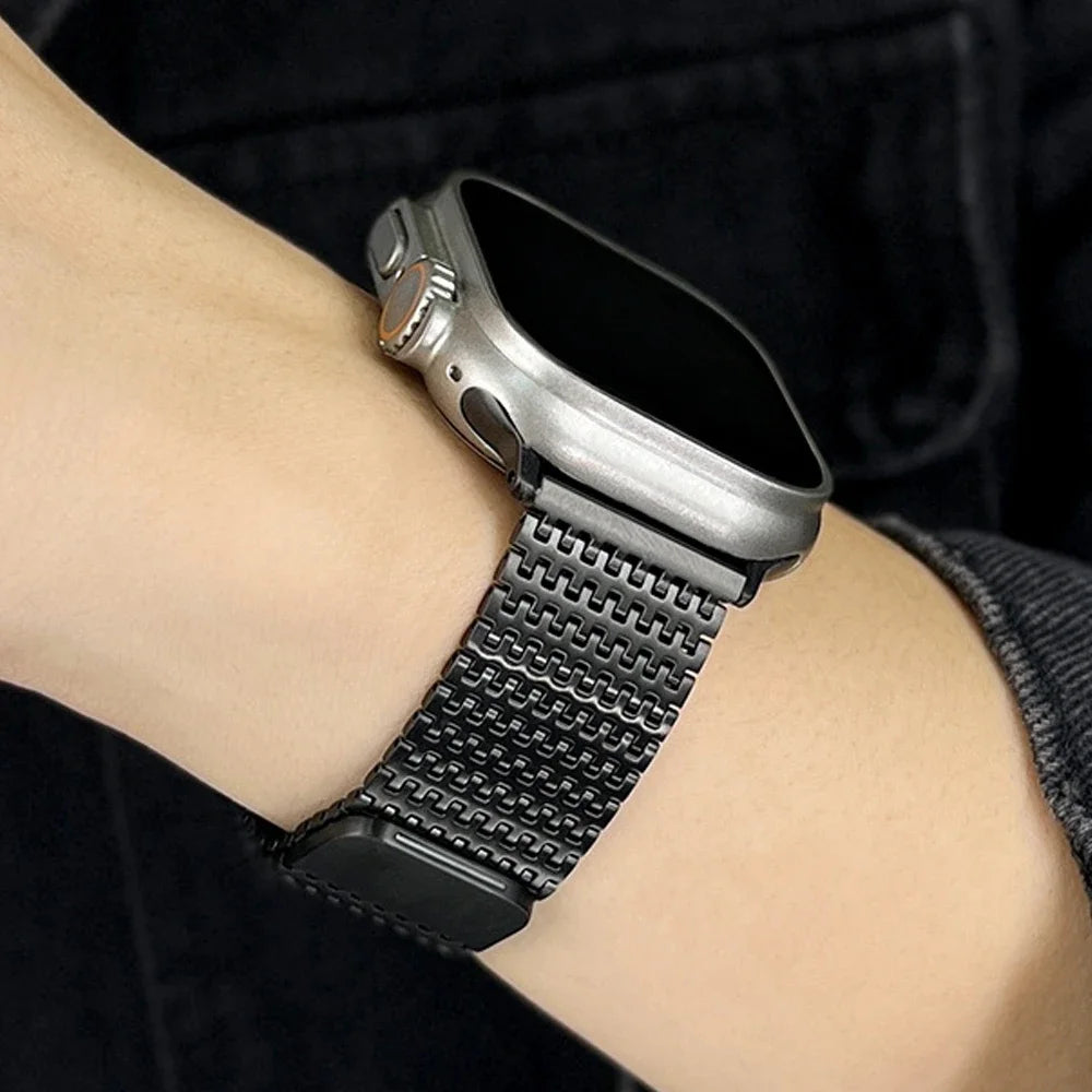Black textured mesh band worn on a wrist for Apple Watch
