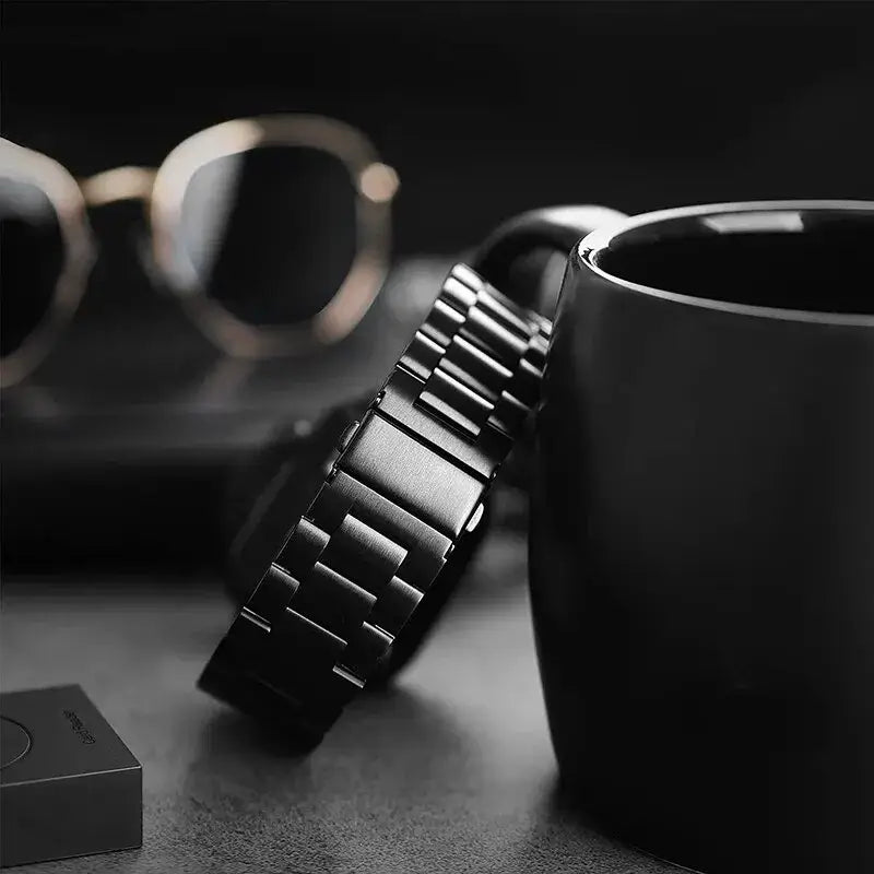 Black wide-link Apple Watch band close-up