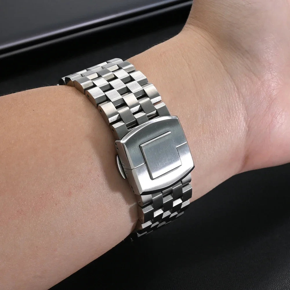 Garmin Stainless Steel Checker-Link Band silver bracelet shown on a wrist