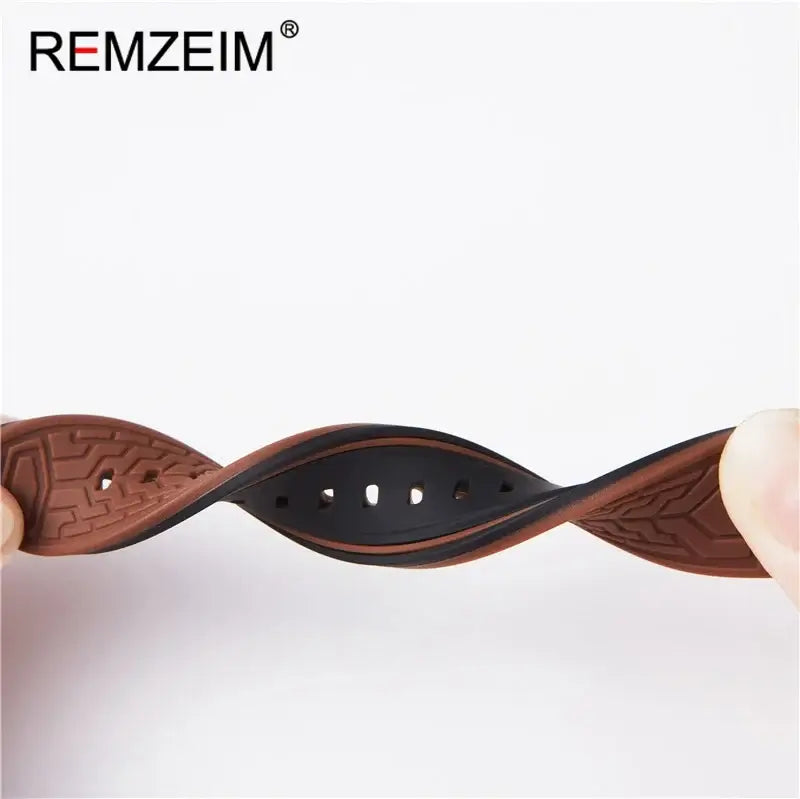 Flexible silicone strap for Suunto watches, showcasing a sleek brown and black design for stylish comfort.