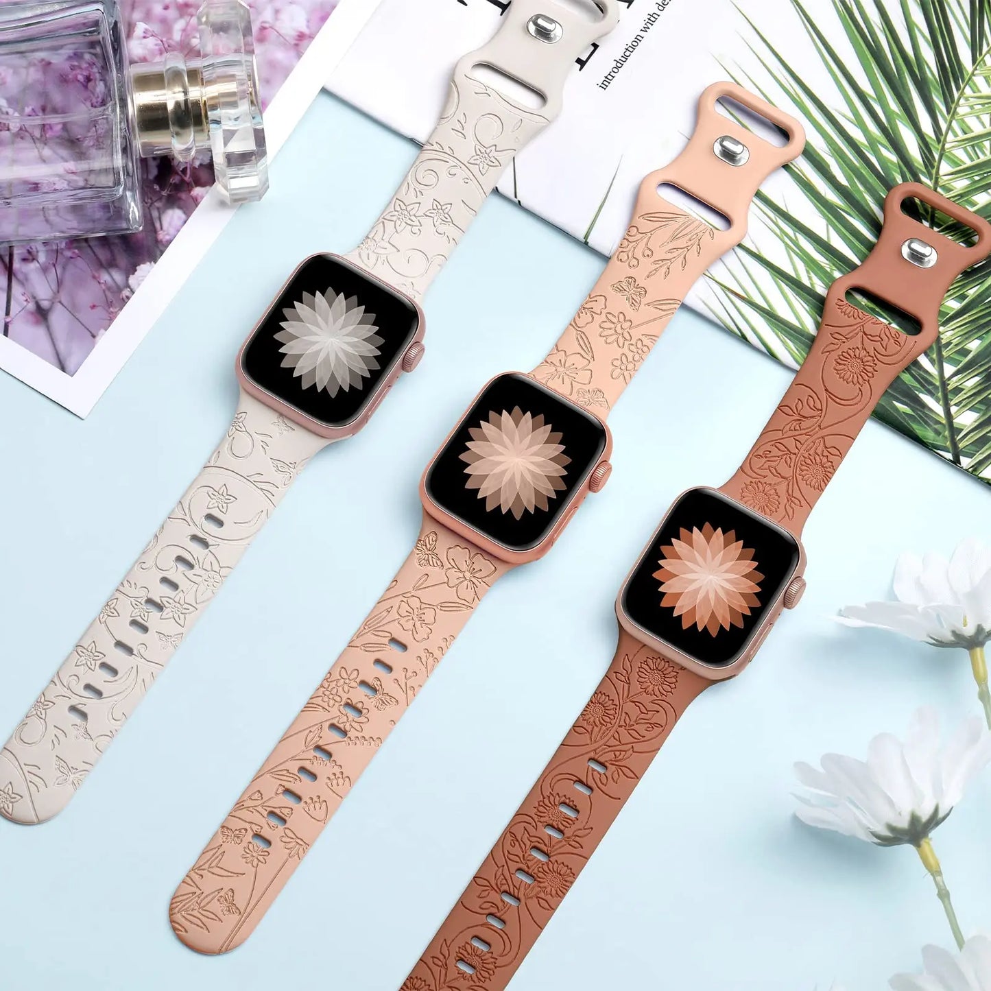 Apple Watch Silicone Straps in floral engravings, showcasing elegance and style in three colors.