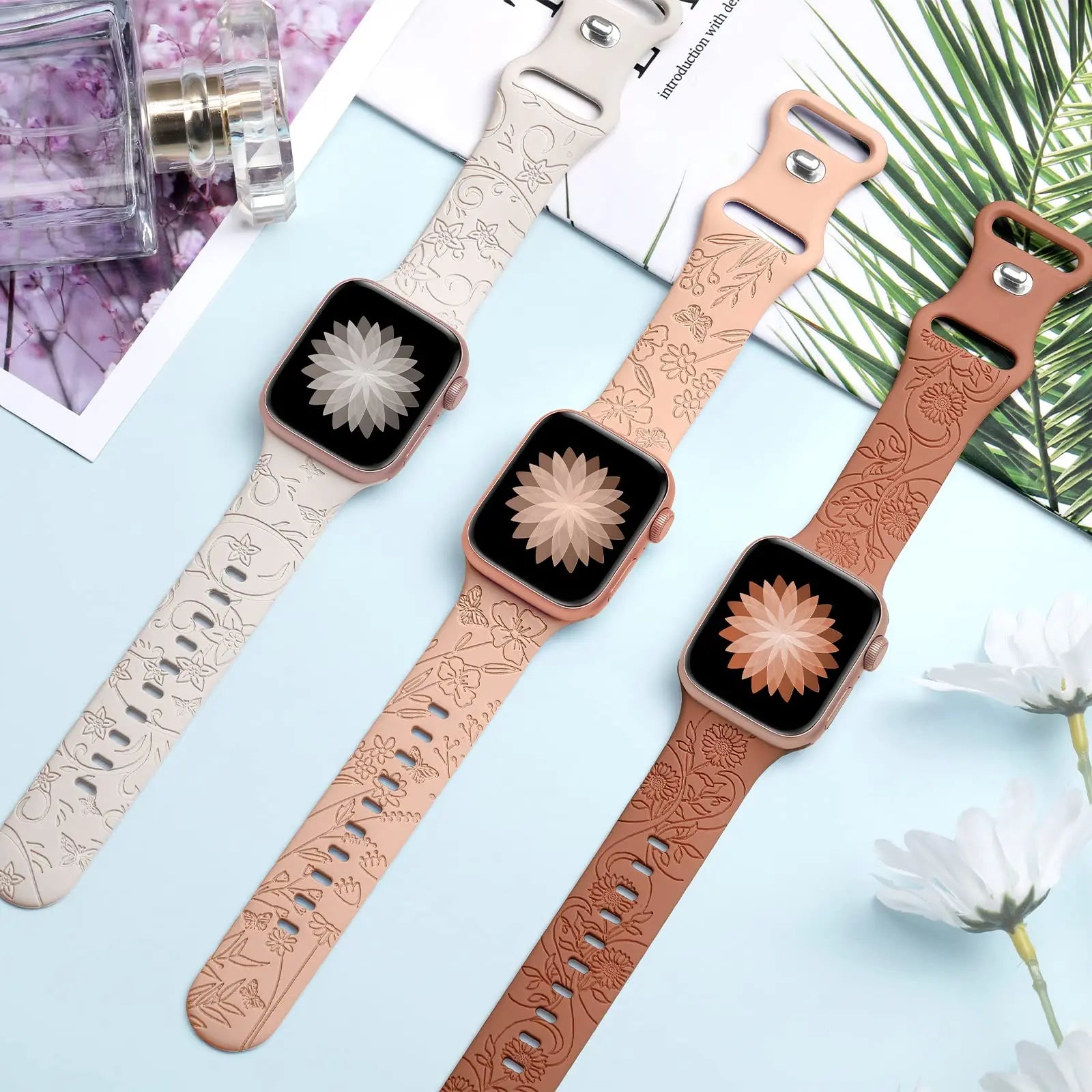 Apple Watch Silicone Straps in floral engravings, showcasing elegance and style in three colors.
