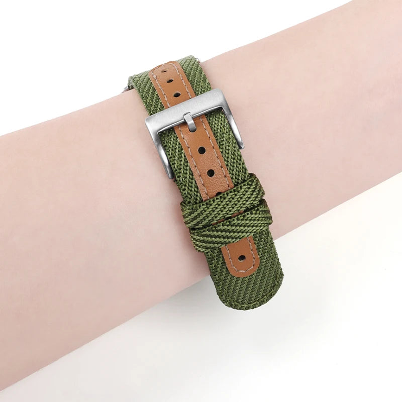 Garmin sport nylon watch strap in green on wrist, featuring a breathable design and quickfit buckle.