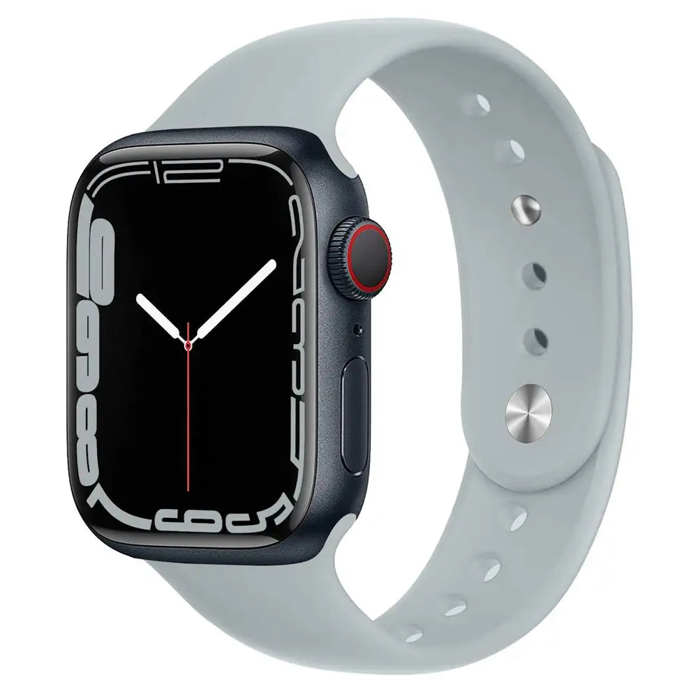 Apple Watch with grey silicone strap, showcasing soft, waterproof comfort for daily wear and workouts.