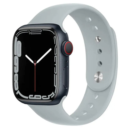 Apple Watch with grey silicone strap, showcasing soft, waterproof comfort for daily wear and workouts.