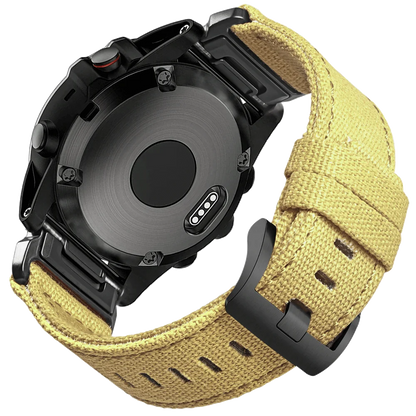 Garmin smartwatch with a rugged yellow woven nylon sport band, featuring a secure G-hook closure for an active lifestyle.