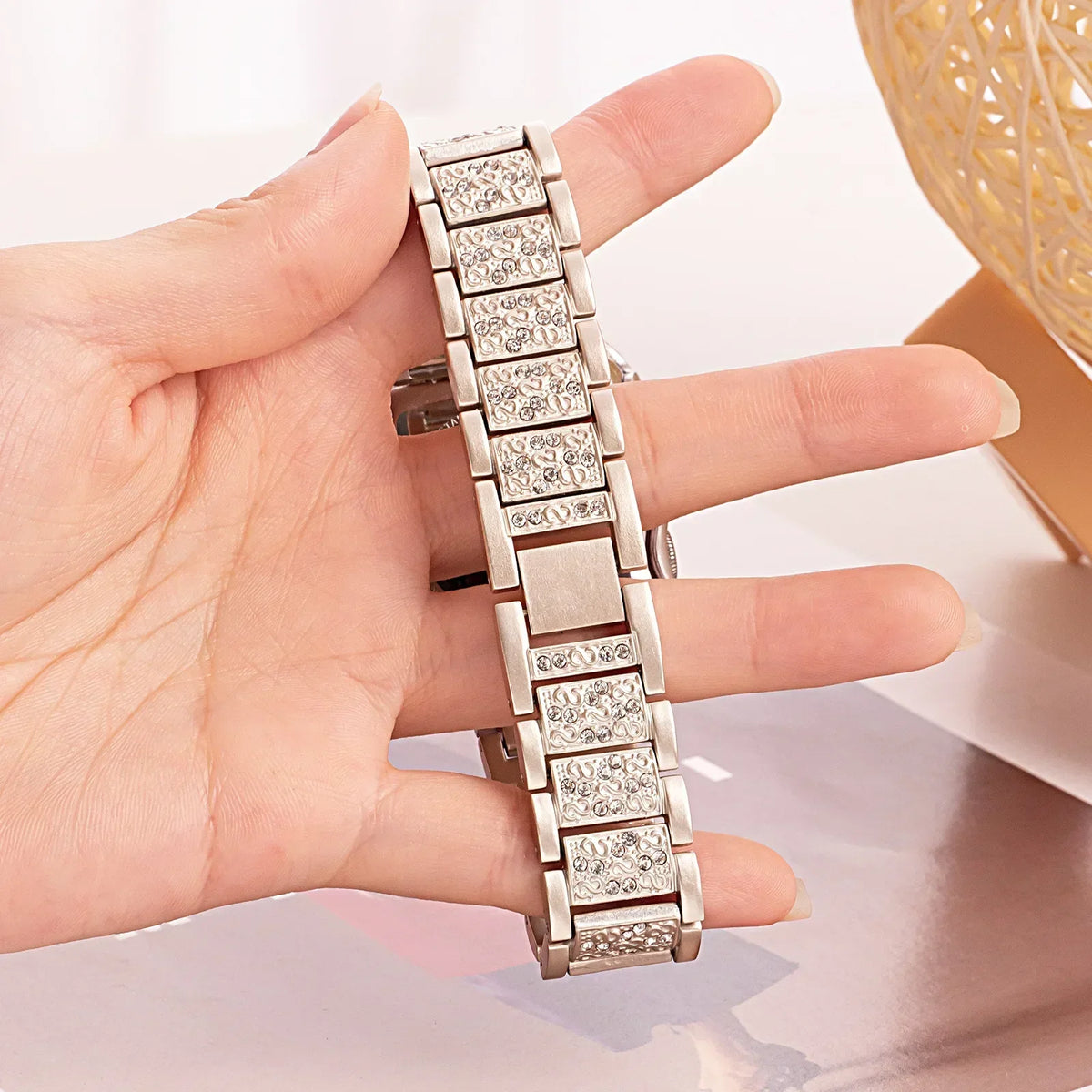 Garmin Women's Rhinestone Link Bracelet — held in hand