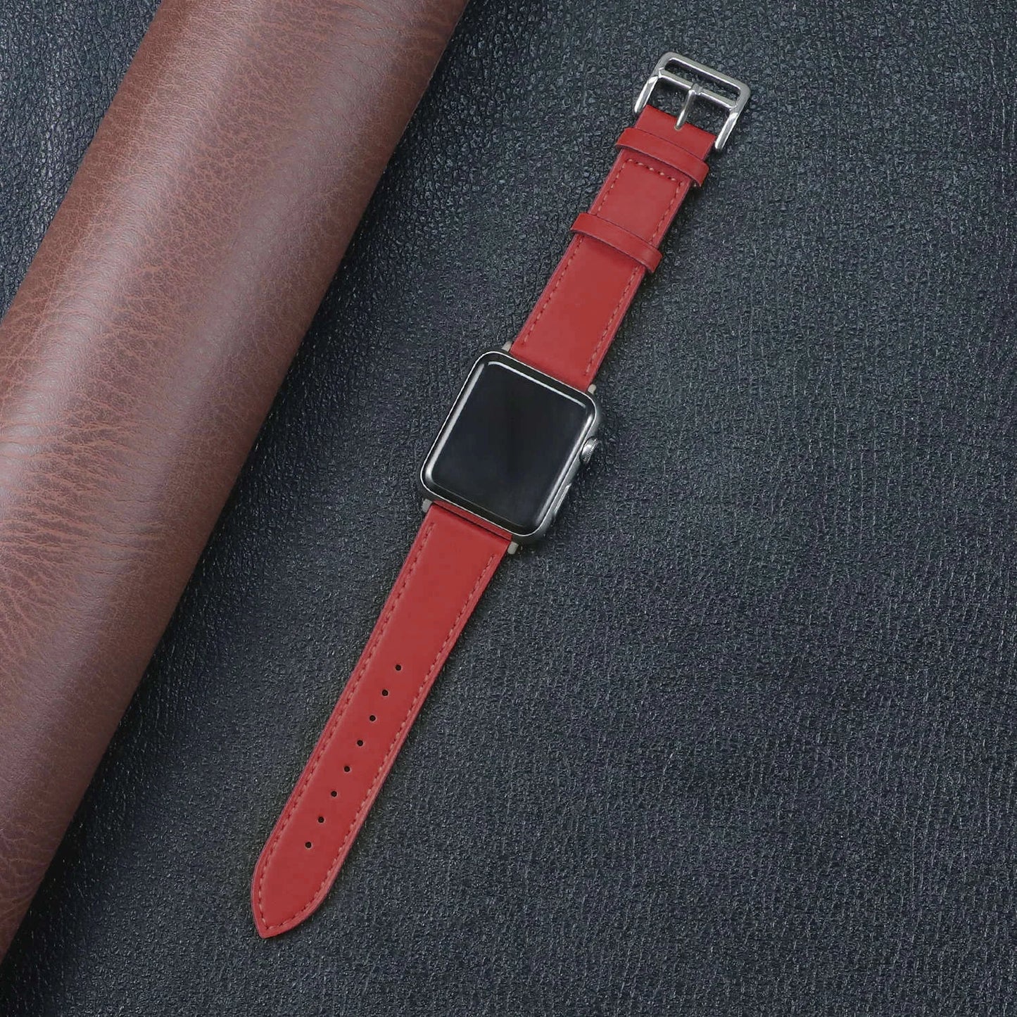 Red Apple Watch Fabric Band on a dark background with leather material, showcasing durability and stylish design.