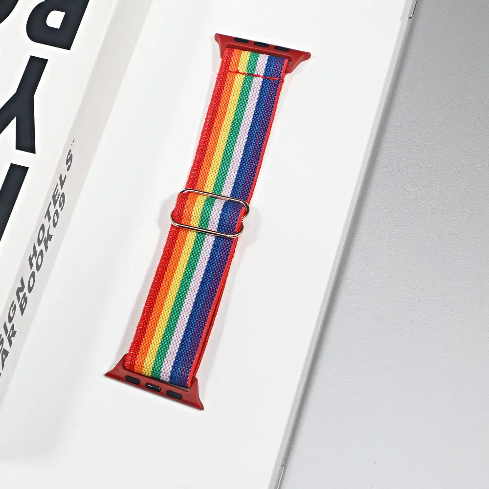 Apple Watch nylon sport loop strap in vibrant rainbow colors, perfect for style and comfort during workouts and daily wear.