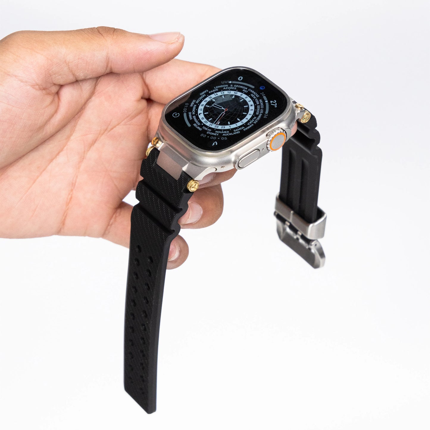 Apple Watch with silicone sports strap in hand, showcasing the waterproof rubber design and adjustable fit.