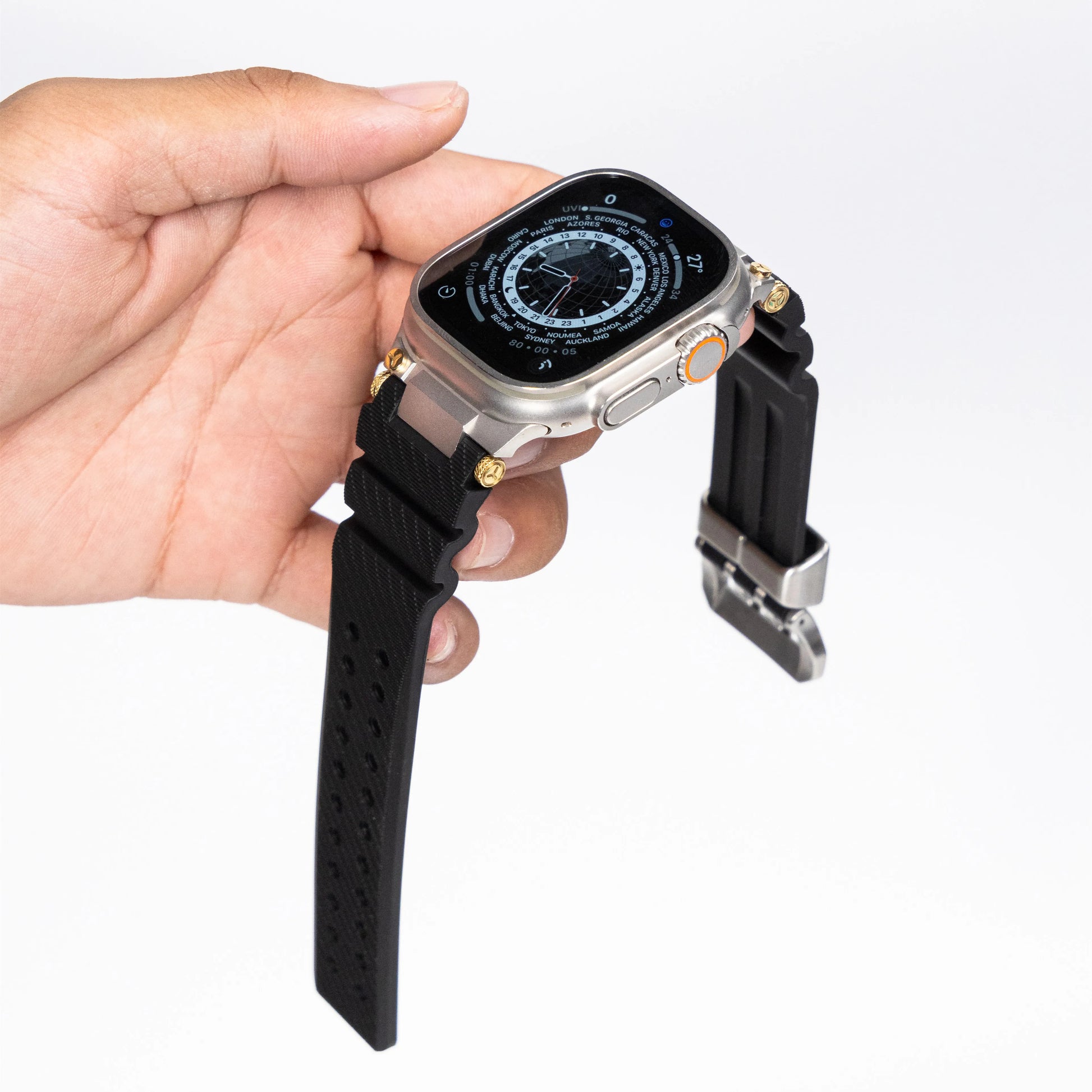 Apple Watch with silicone sports strap in hand, showcasing the waterproof rubber design and adjustable fit.