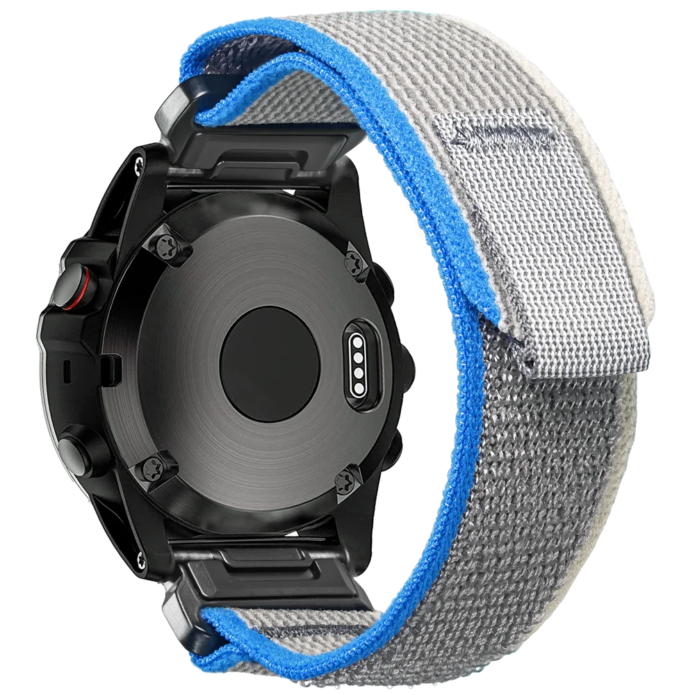 Garmin smartwatch with a rugged woven nylon replacement band, showcasing durable materials and comfort fit design.