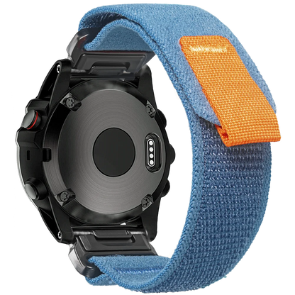 Garmin rugged woven nylon sport band in blue with orange loop, designed for comfort and durability for smartwatches.
