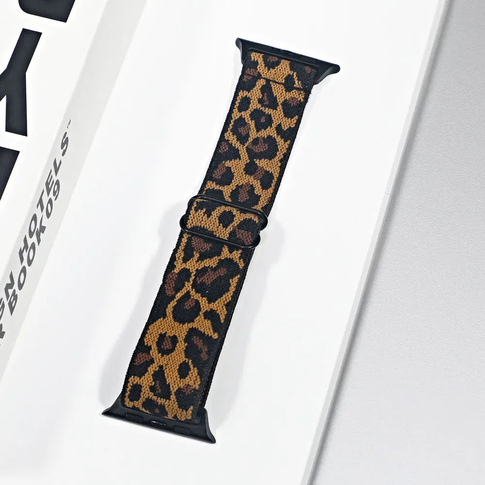 Bold leopard print nylon strap for Apple Watch, featuring a breathable design for comfort and style.