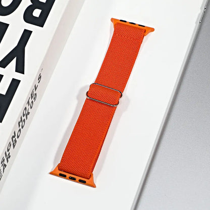 Apple Watch nylon sport loop strap in vibrant orange, designed for style and all-day comfort while being breathable.