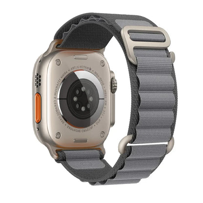 Apple Watch with rugged nylon strap in grey, showcasing durability and comfort for outdoor adventures.