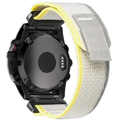 Garmin smartwatch with a rugged woven nylon sport band in white and yellow, showcasing durability and comfort.