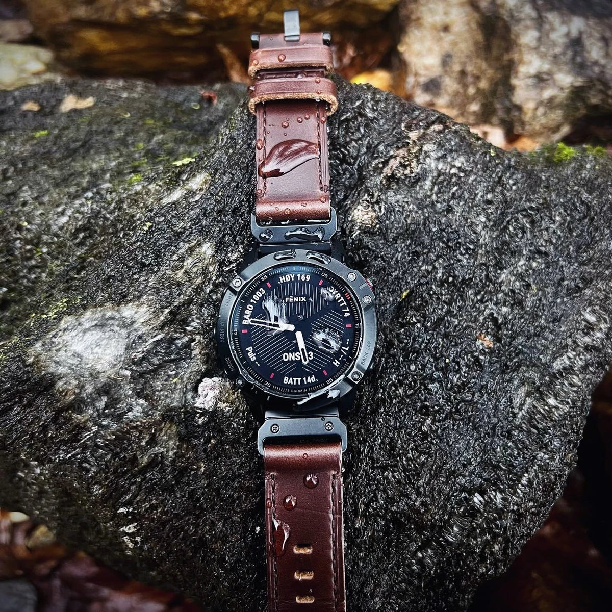 Garmin QuickFit Horween Leather Buckle Band brown leather band shown on a watch outdoors
