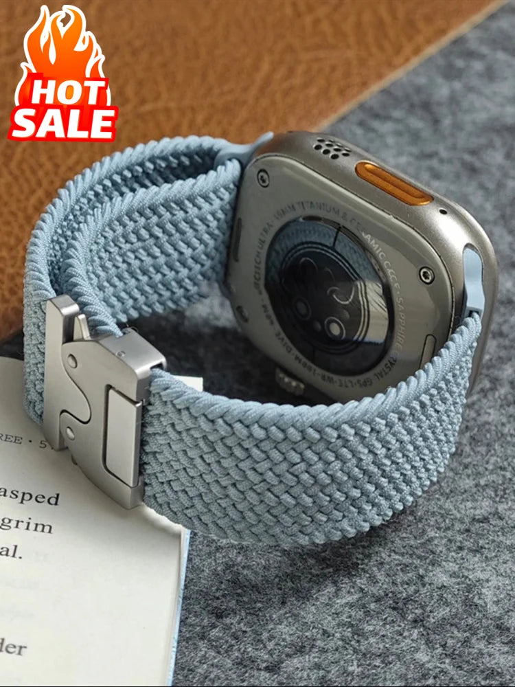 Light blue braided Apple Watch band showing parachute-style buckle