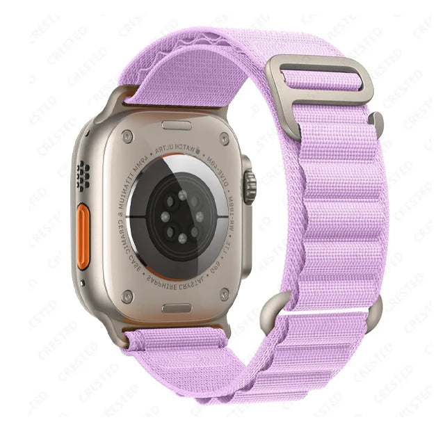 Apple Watch with purple nylon strap, featuring a durable and comfortable design ideal for outdoor activities.