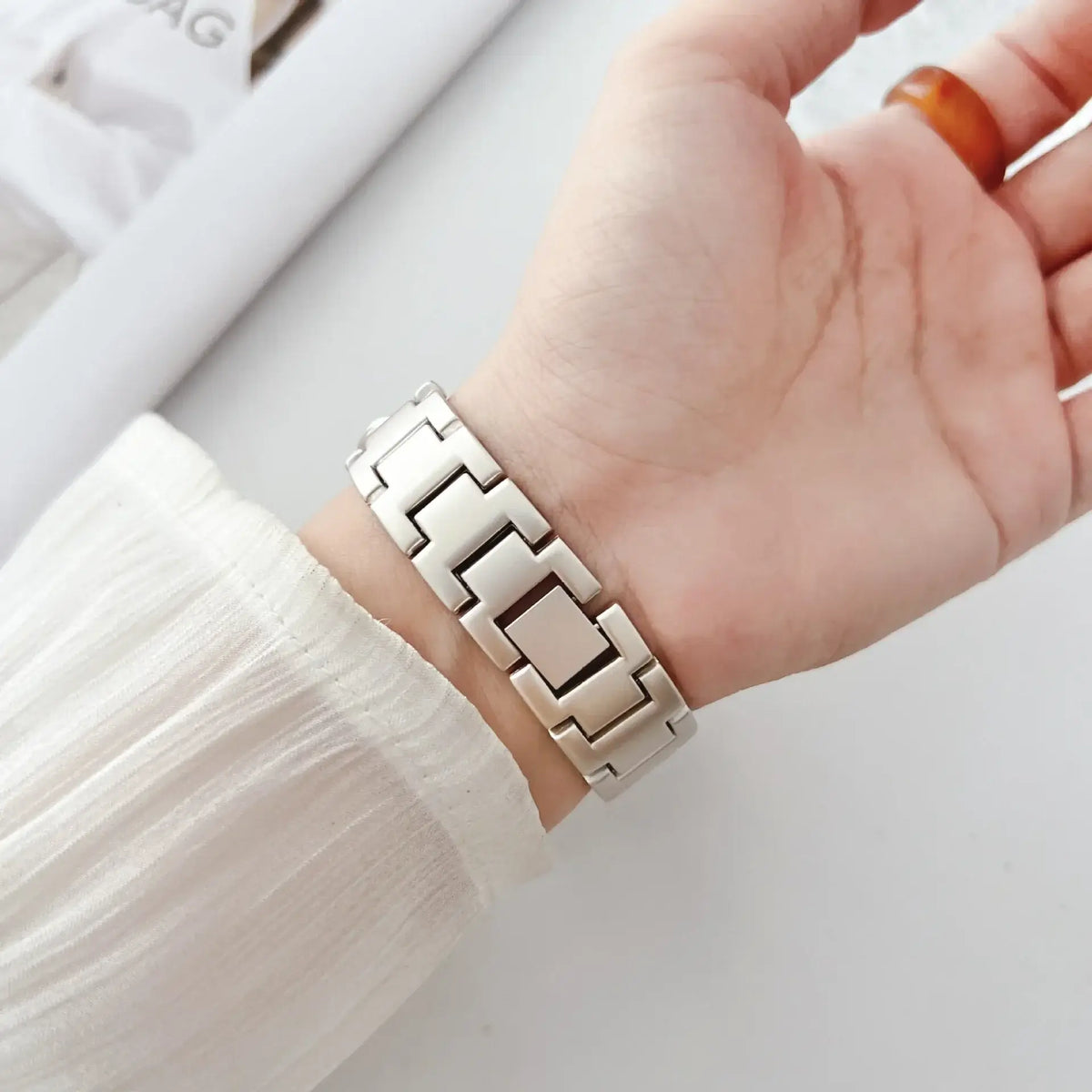Close-up of Apple Watch chain bracelet folding clasp