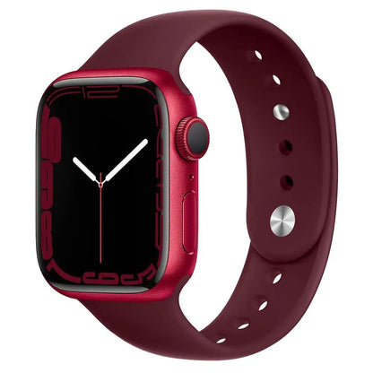 Apple Watch in red color with a silicone strap, showcasing a stylish and modern design.