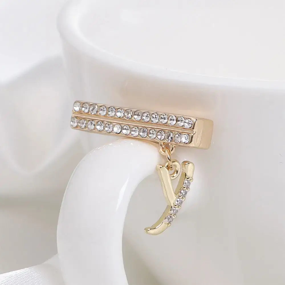 Decorative golden letter charm with rhinestones for Apple Watch band, adding luxury and style to your smartwatch.