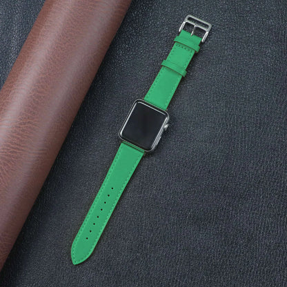 Green fabric strap for Apple Watch, featuring a metal buckle and a stylish design for comfort and durability.