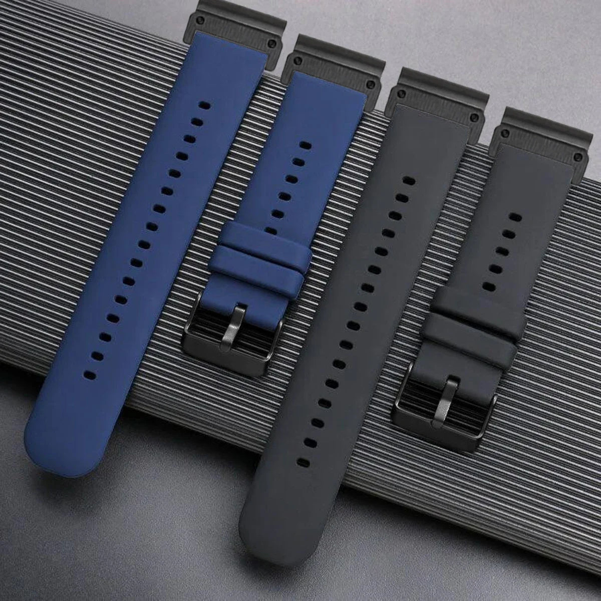Garmin silicone watch straps in blue and black, perfect replacement bands for smartwatch, designed for comfort and flexibility.