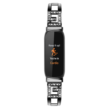 Fitbit Inspire 3 with metal diamond band displaying cardio mode, showcasing stylish bandsco straps for smartwatches.