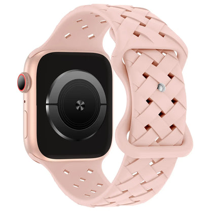 Apple Watch with pink braided silicone strap, sporty and breathable design for comfort during active lifestyles.