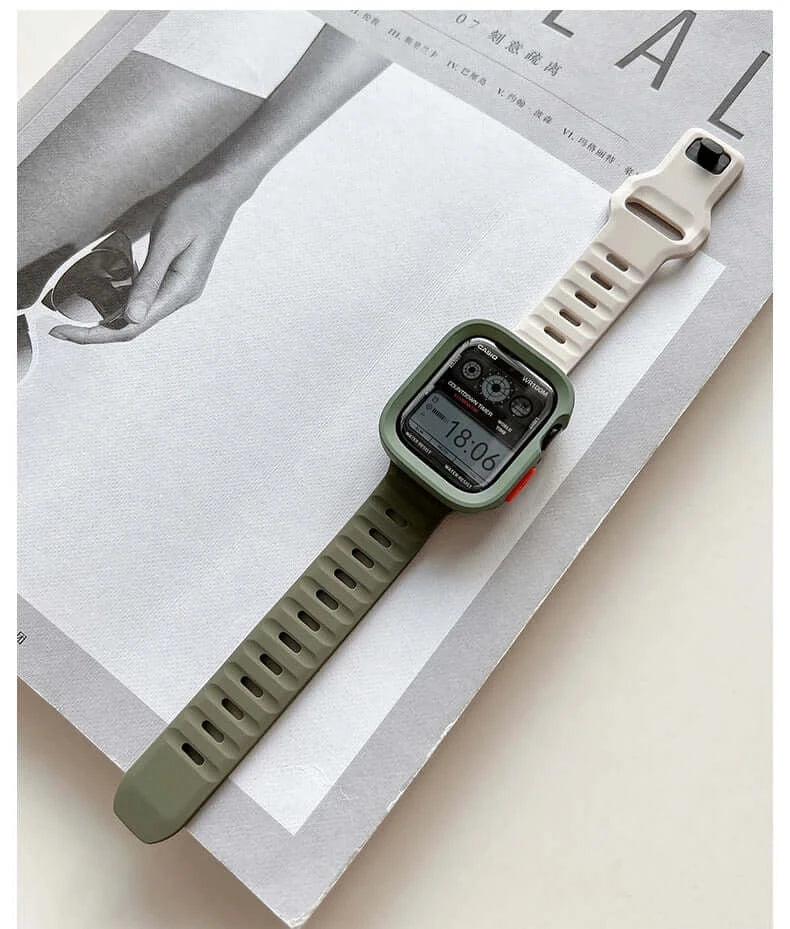 Olive green bumper case and ivory silicone Apple Watch band laid flat.