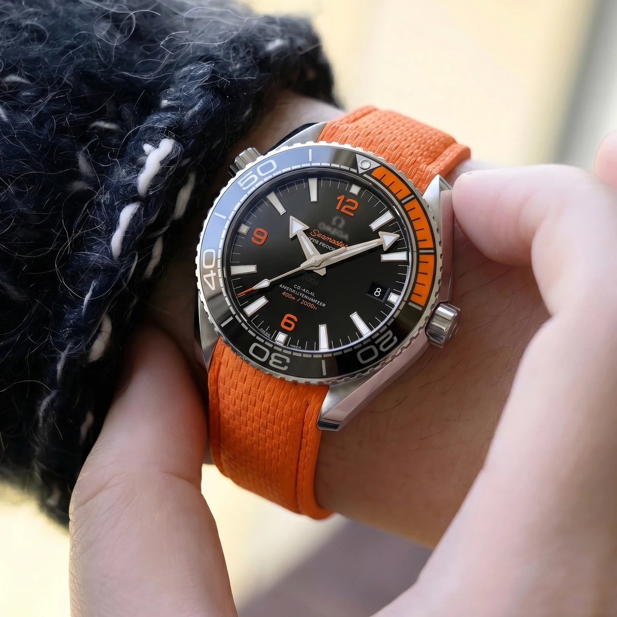 Garmin Curved-End FKM Rubber Band in orange worn on a wrist