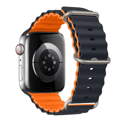 Apple Watch with black and orange silicone strap, designed for comfort, waterproof and breathable for active lifestyles.