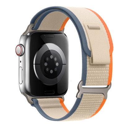Apple Watch Trail Loop Nylon Strap in beige and orange, durable, lightweight, and adjustable for maximum comfort.