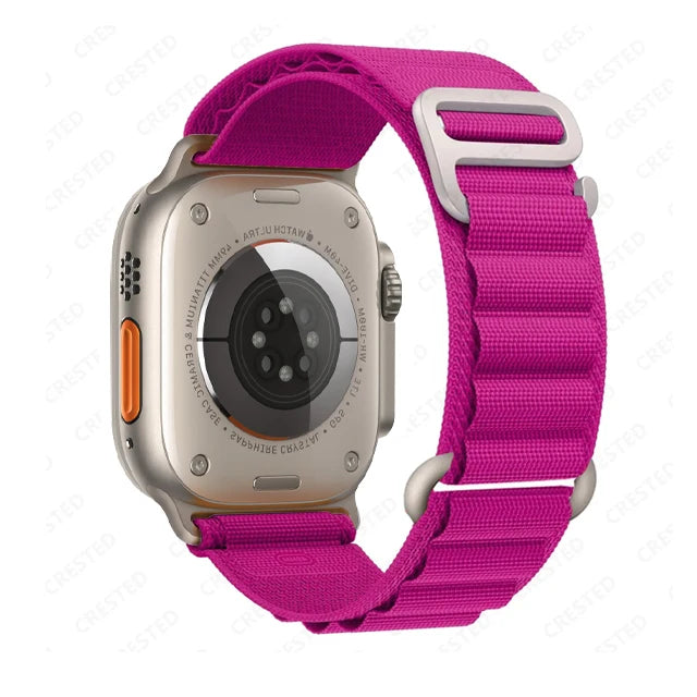 Apple Watch with rugged nylon strap in bright pink color, showcasing durability and stylish design.