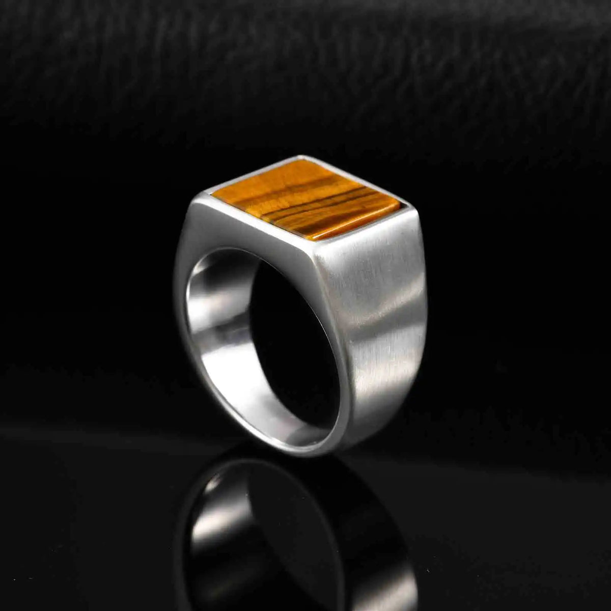 Tiger's eye 14mm signet ring, stainless steel, dark background