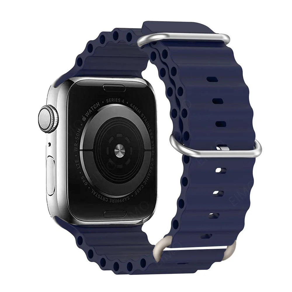 Apple Watch with navy silicone strap, waterproof and breathable for comfort during workouts and water sports.