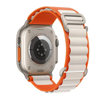 Apple Watch with rugged nylon strap in orange and white, designed for comfort and durability for outdoor activities.