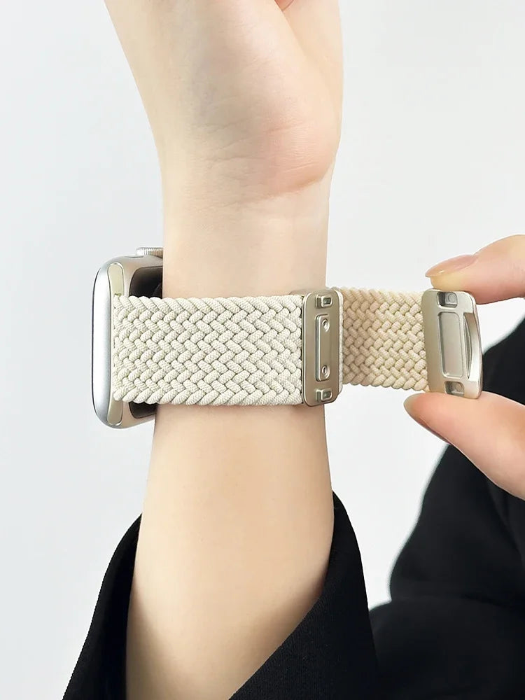 Apple Watch Nylon Band in cream color, showcasing braided design and stainless steel buckle on a wrist.