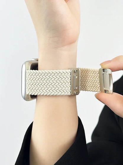 Apple Watch Nylon Band in cream color, showcasing braided design and stainless steel buckle on a wrist.