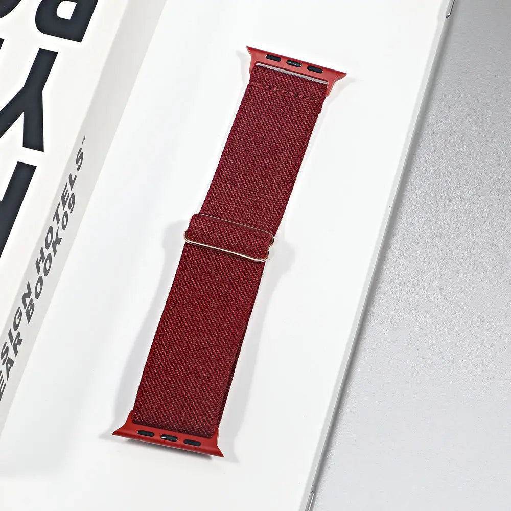 Apple Watch nylon sport loop strap in burgundy, showcasing breathable fabric and versatile design for comfort.