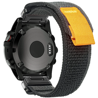 Garmin rugged woven nylon sport band for smartwatch, featuring durable black strap with orange accent for comfort and style.