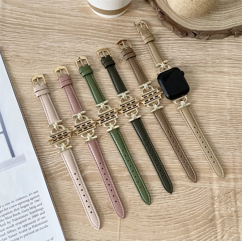 Slim leather Apple Watch bands with gold-finish decorative connectors displayed together