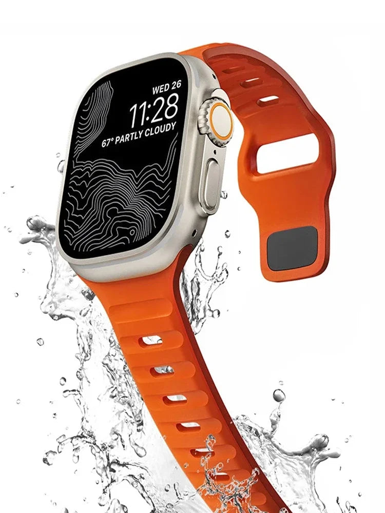 Orange slotted silicone band shown in water-splash illustration for Apple Watch