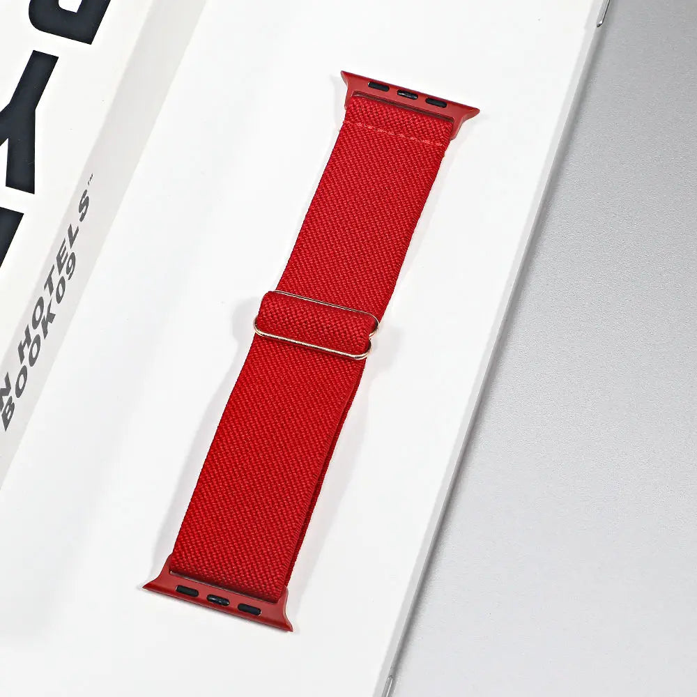 Red nylon sport loop strap for Apple Watch, breathable and stylish replacement band.