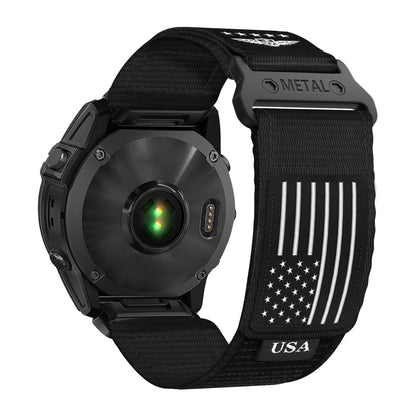 Garmin smartwatch featuring a black nylon Trail Loop band with USA flag design and metal clasp, designed for active lifestyles.