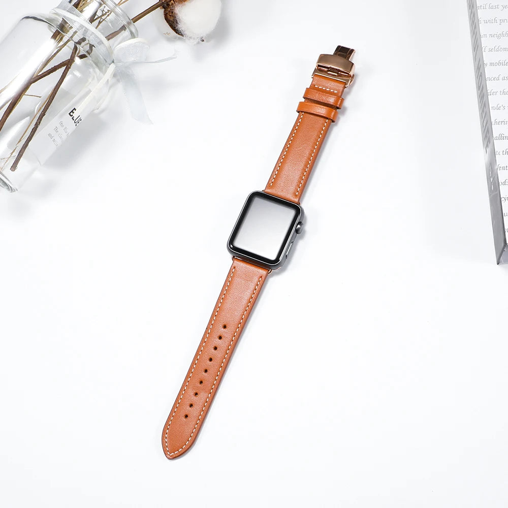 Tan leather strap displayed flat for Apple Watch